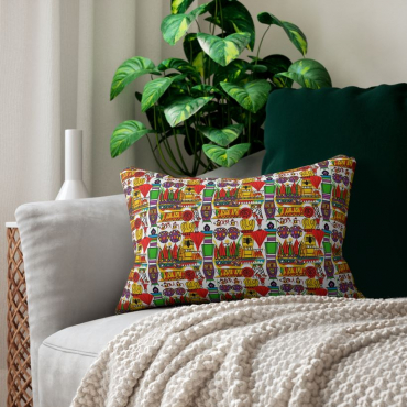 African print depicting jars and feathers on a couch cushion