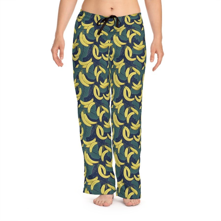 Pattern of bananas on a dark background printed on pajama pants